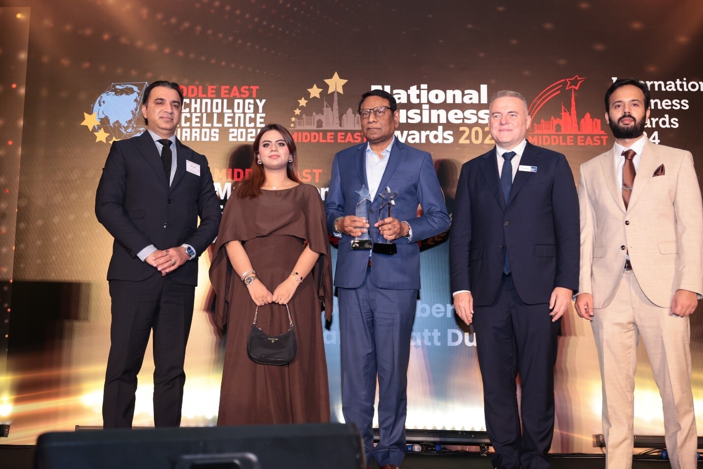 Petromin team on stage at an awards ceremony